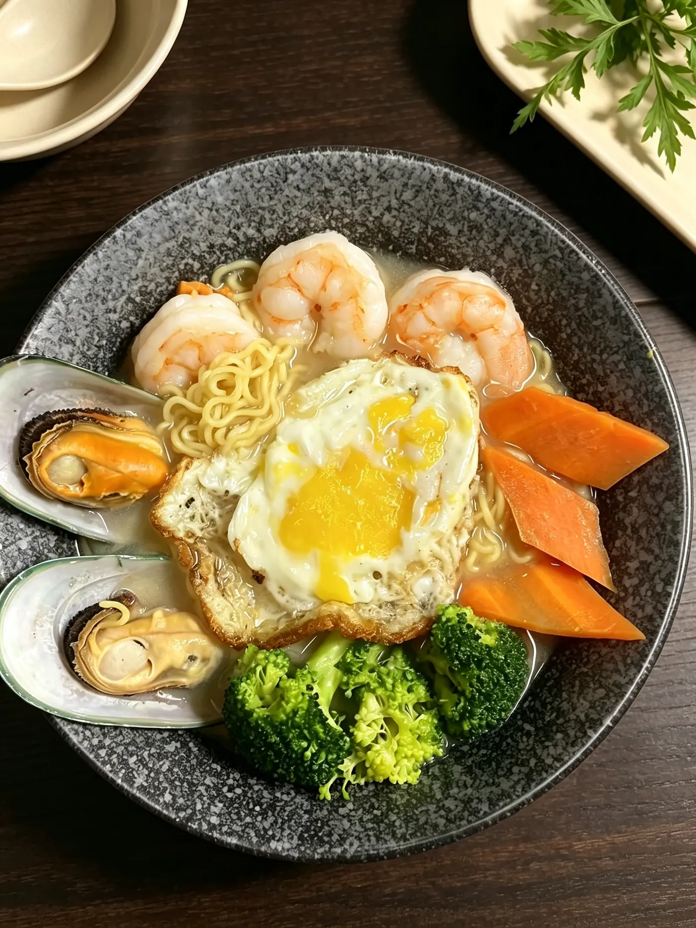 Seafood noodle soup with shrimp, mussels, carrots and a fried egg at Peking Garden Asian Cuisine